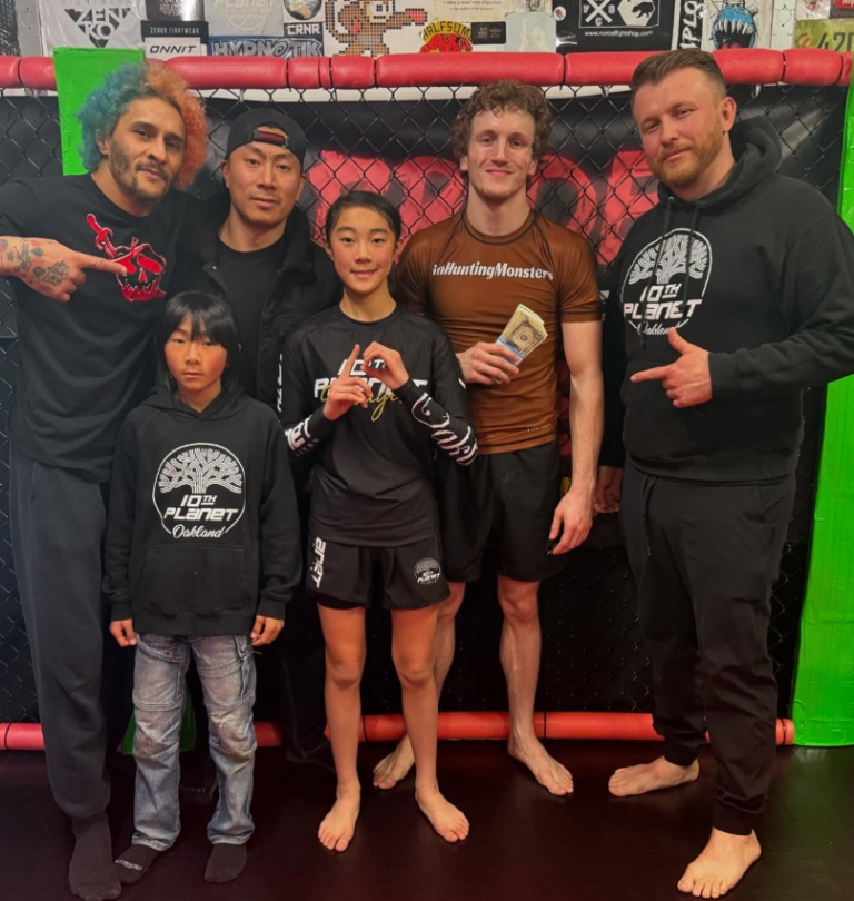 10th Planet Oakland coach Corbin Bilund and teammates after his submission victory at Pride of the Streets