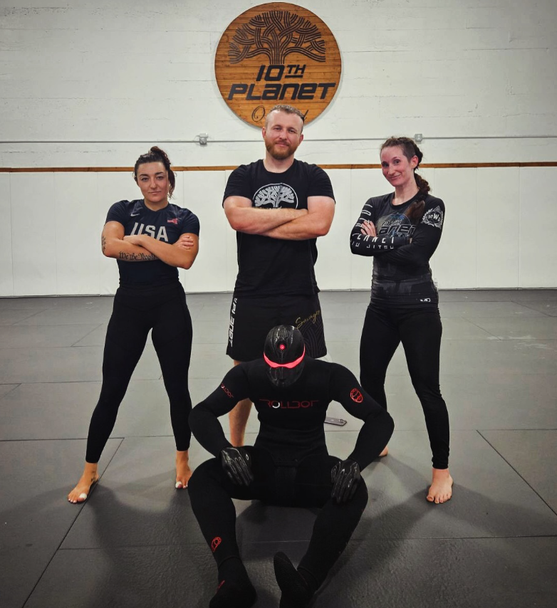 Michael Hillebrand, Bre Stikk and the 10th Planet Oakland team testing the Rollbot Jiu Jitsu training dummy