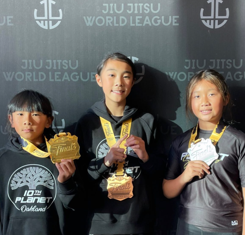 10th Planet Oakland youth competitors Mason Choi, Caitlyn Choi and Violet Choi with medals at the Jiu Jitsu World League Finals